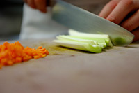leeks and carrots being chopped image