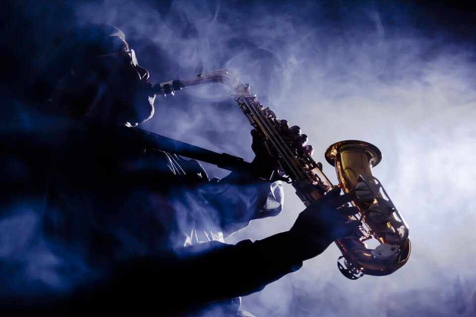 image of a man playing a saxophone
