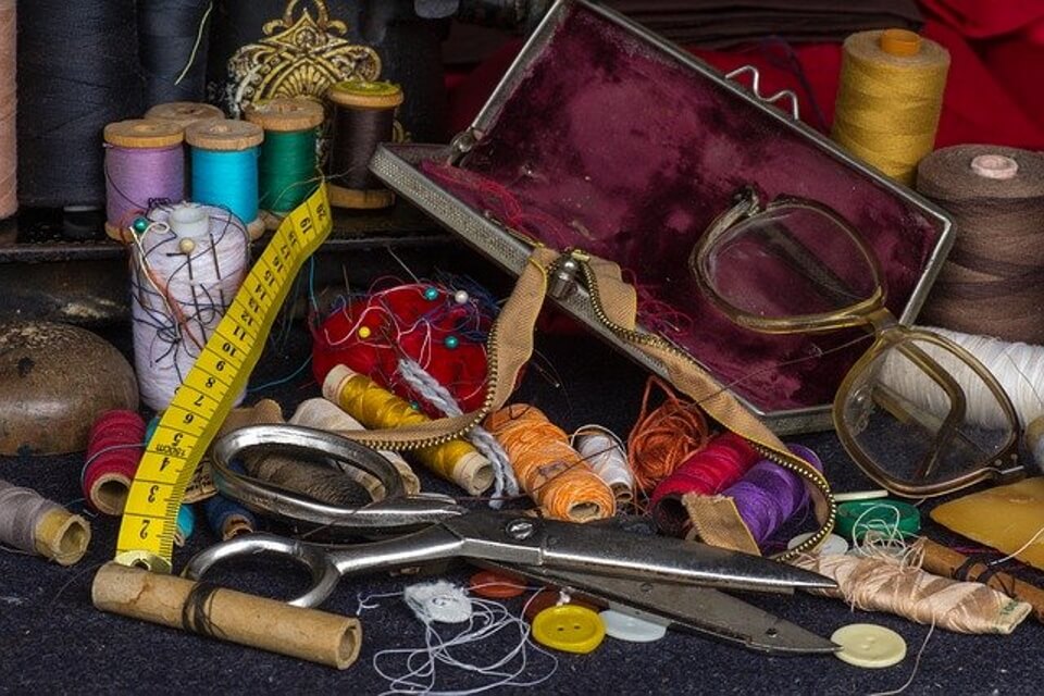 image of sewing kit and glasses