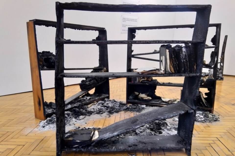 image of burnt bookshelves