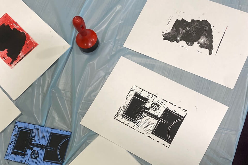 image of sheets with lino print on them