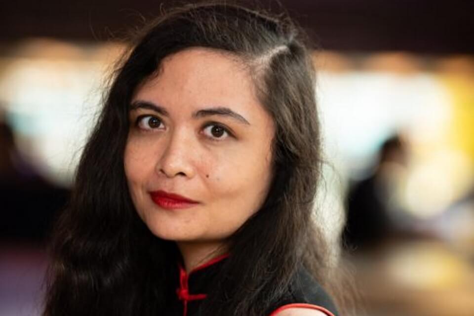 Photographic head shot of the author in full colour