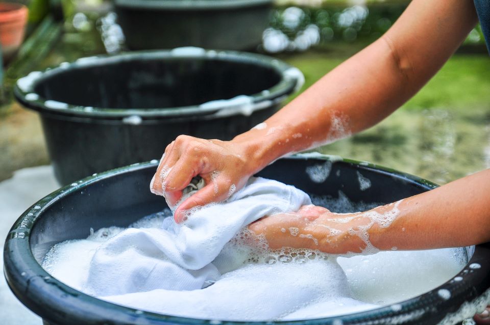 Hand Washing Laundry in a Bucket