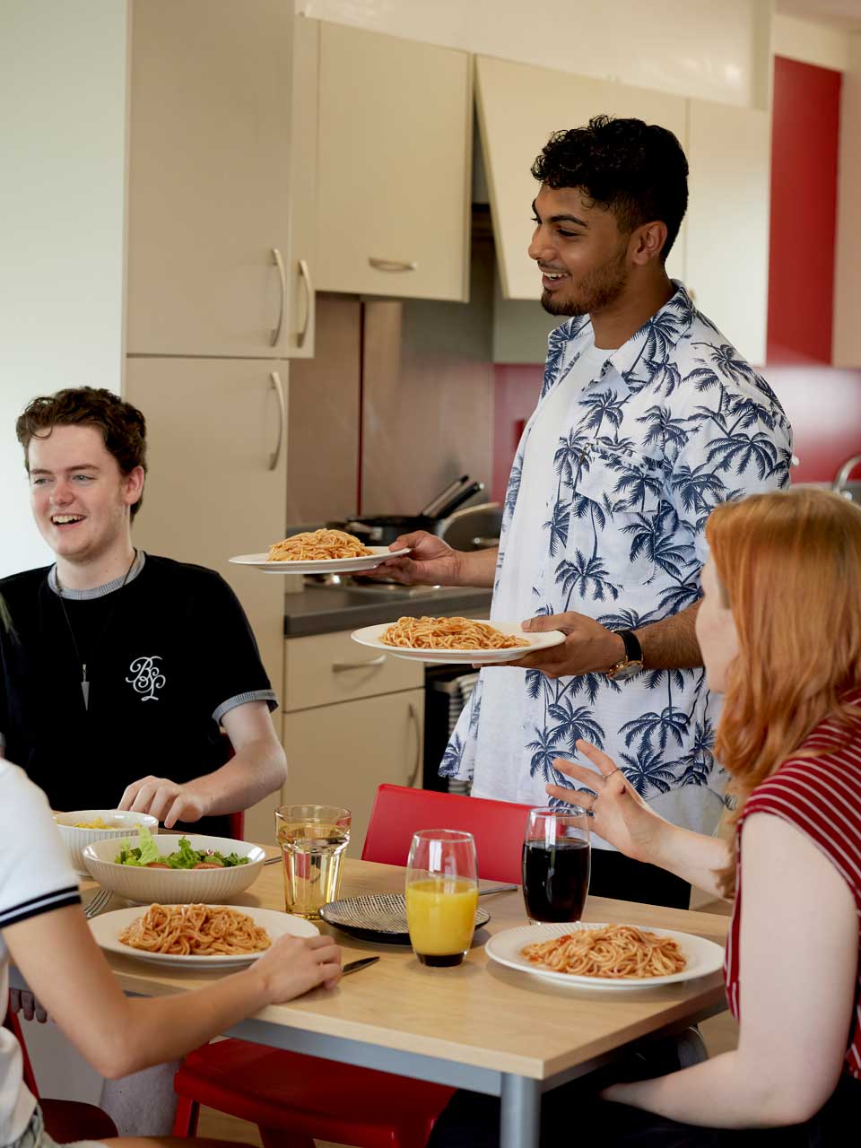Students in the kitchen making food together