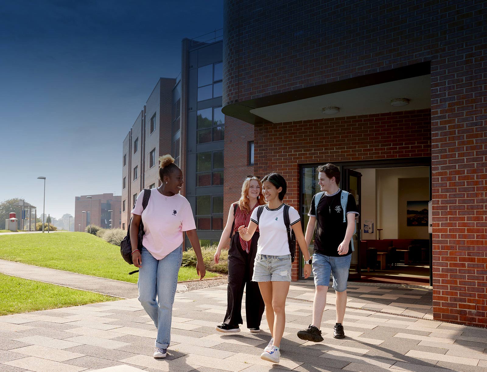 Students walking out of campus accommodation block at Barnes Hall