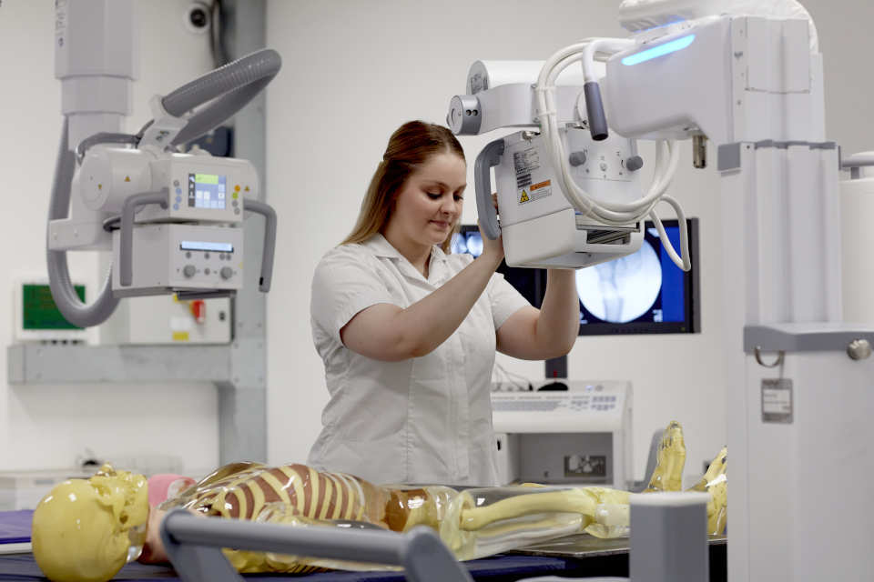 A radiography student undertaking a scan.