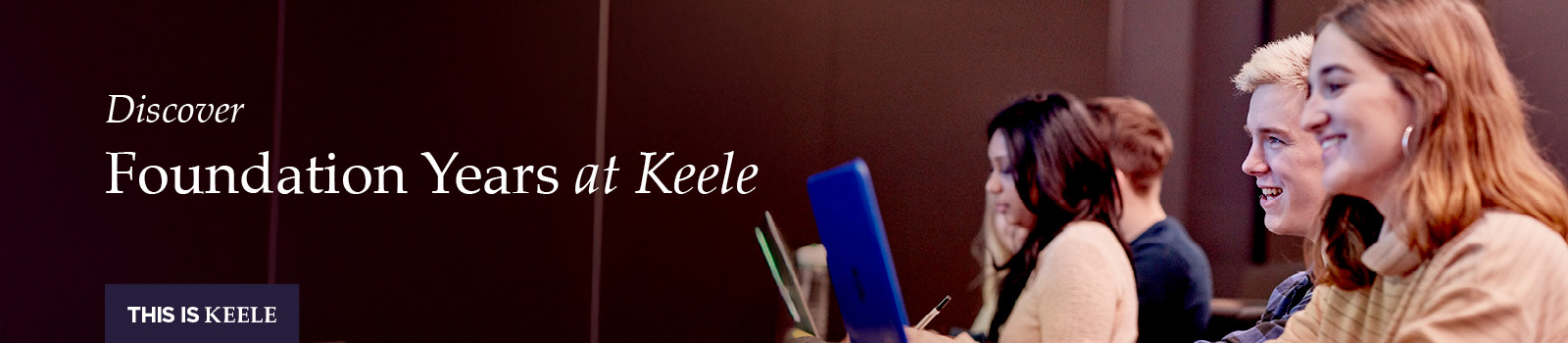 2 students looking at a laptop screen