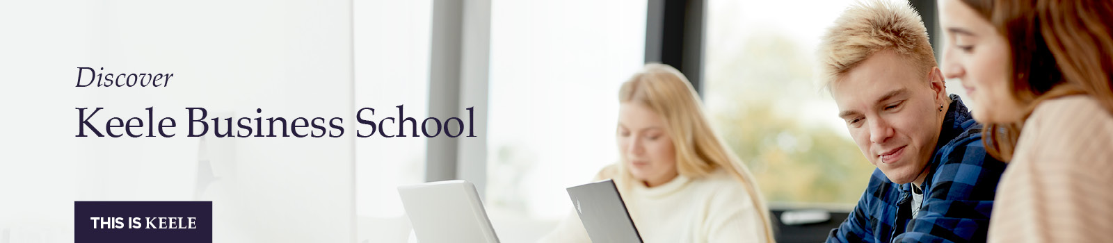 3 students using a laptop