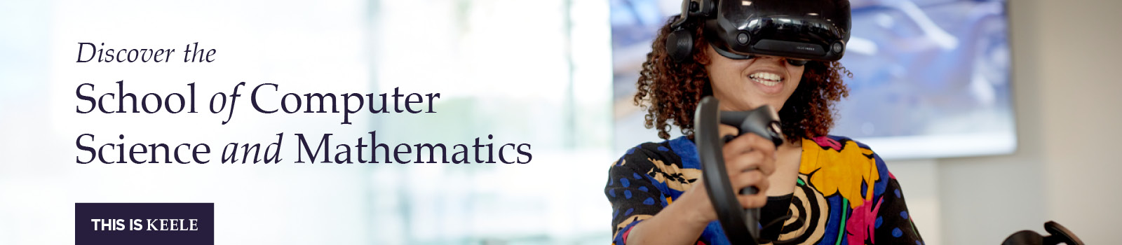 Lecturer standing in front of a whiteboard with maths equations