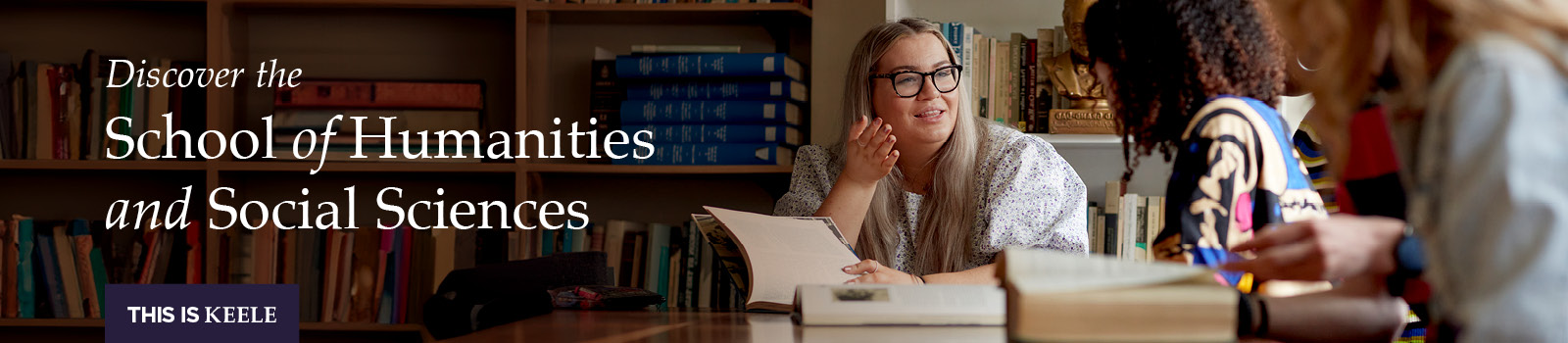 Students chatting over a textbook