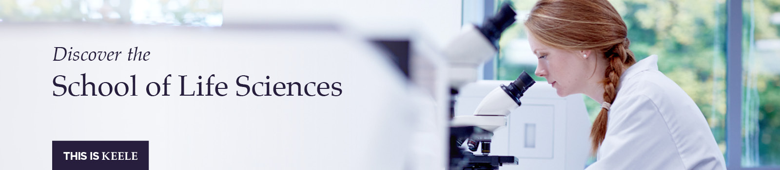 Student looking in a microscope