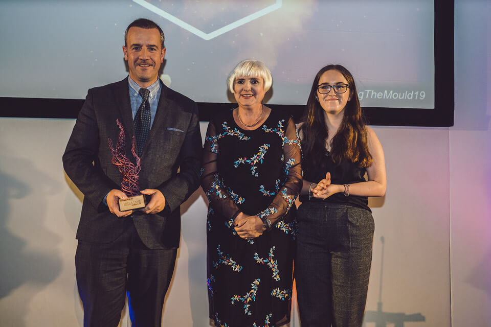 Winner on stage for Bringing Learning to Life Hardy Signs