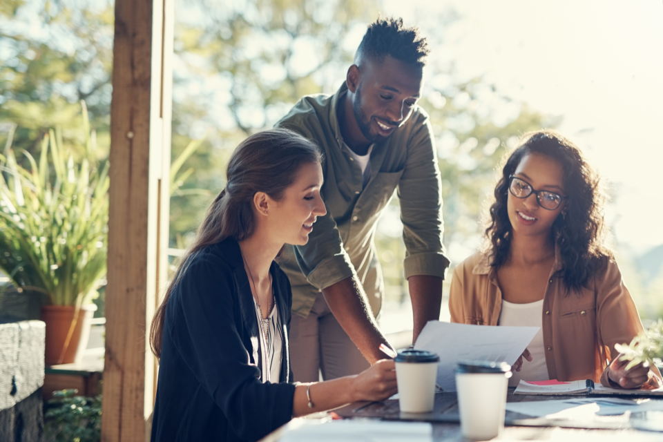 Three people working at a table