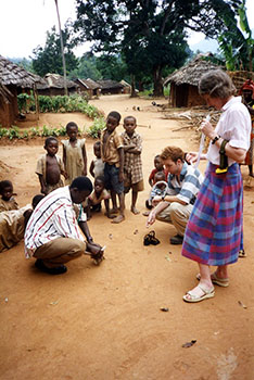 Right - Hilary Hurd on the hunt for mosquito samples in a Tanzanian village in East Africa