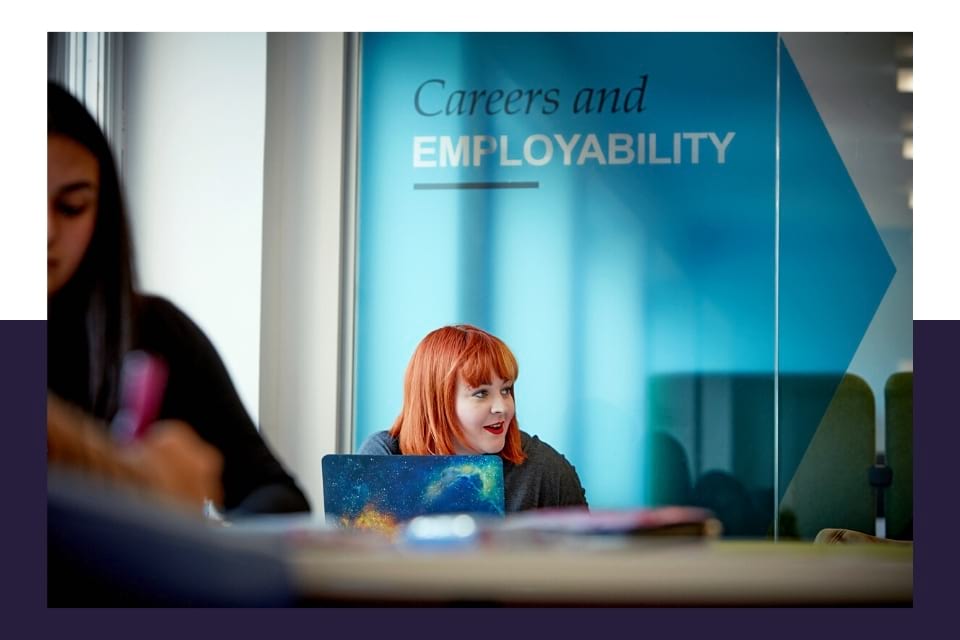 Person chatting in front of a laptop outside Careers and Employability department