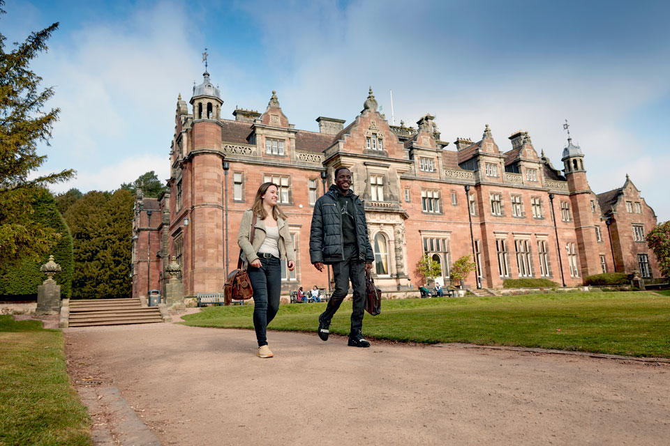 Students walking in the grounds of Keele Hall.