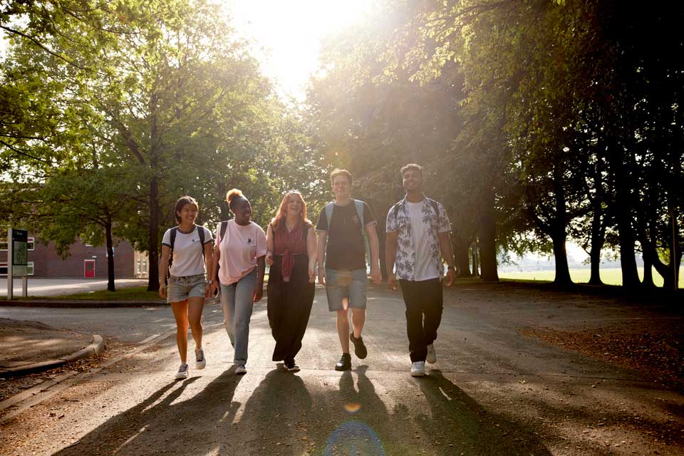 students walking across campus