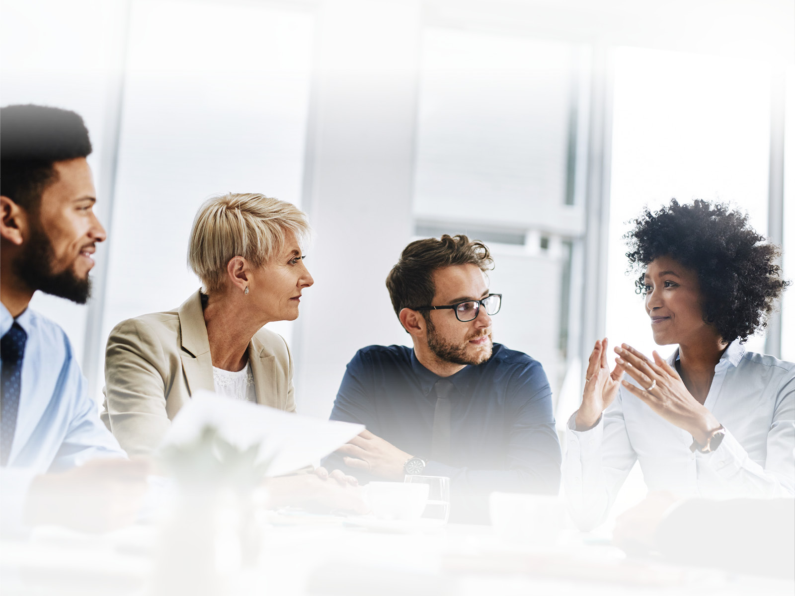 Four team members having a meeting