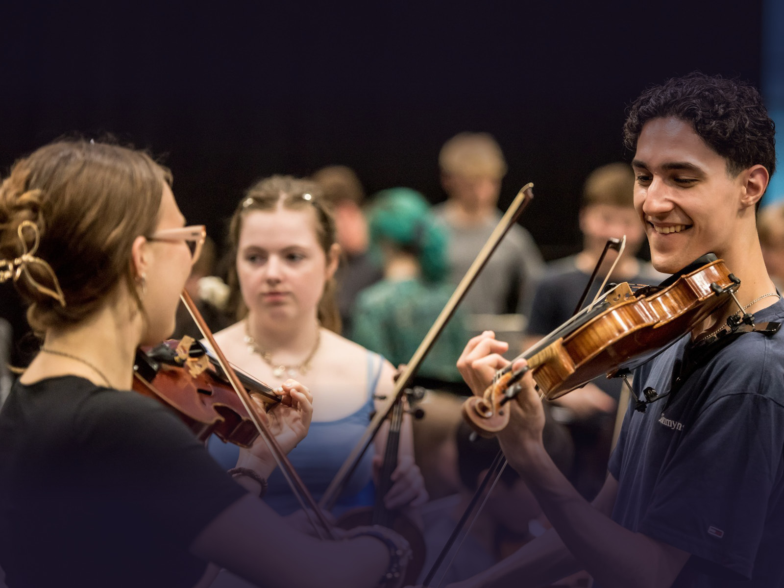 An orchestra playing together and having fun