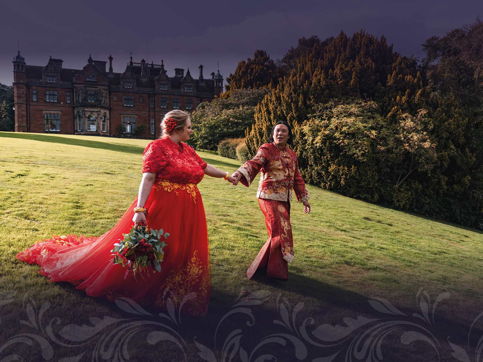 Married couple walking down a hill holding hands