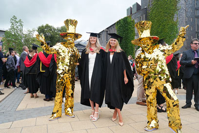 The gold men that took graduates over to the festival