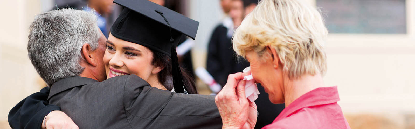 Photo of people congratulating a graduand