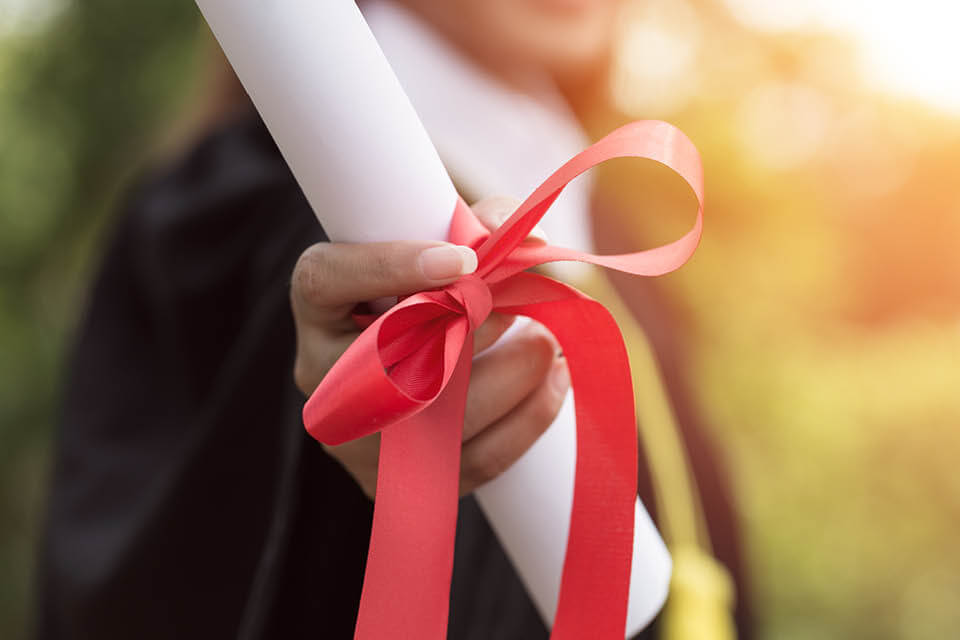 Student holding diploma