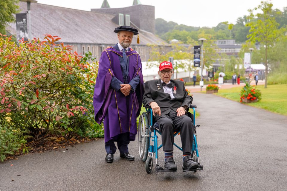 Photo of student being handed their graduation certificate