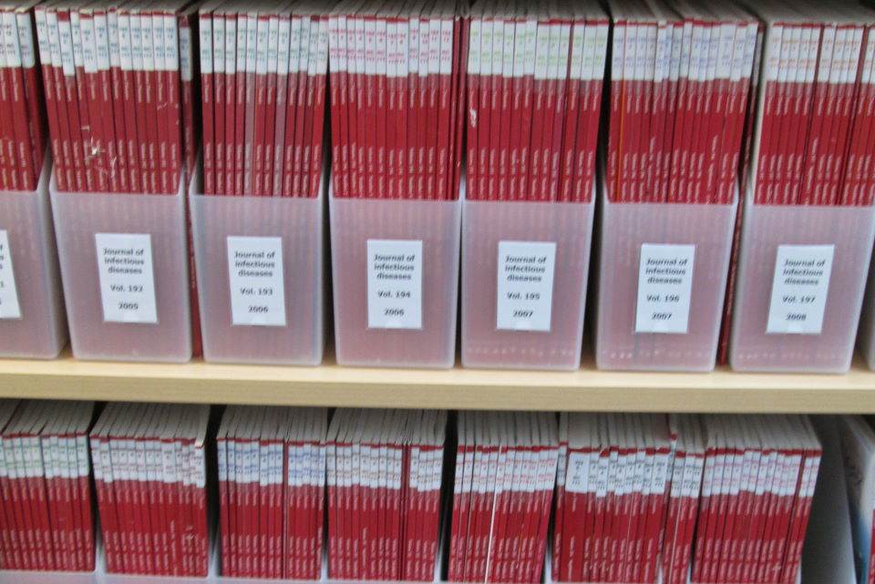 Journal issues in boxes on a shelf