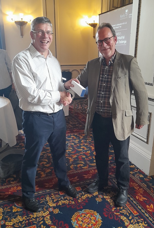Martin Wikinson receiving a token gift from ILAS Director, Tim Lustig