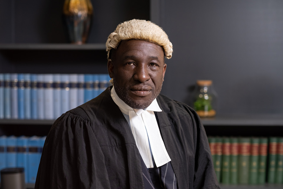Photo of Earl Pinnock in barrister robes 