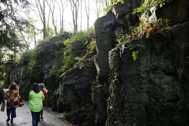 people walking through a rocky path