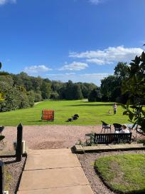 People outdoors on the lawn of keele hall