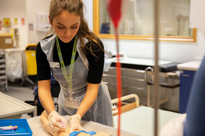 Student practicing a venepuncture