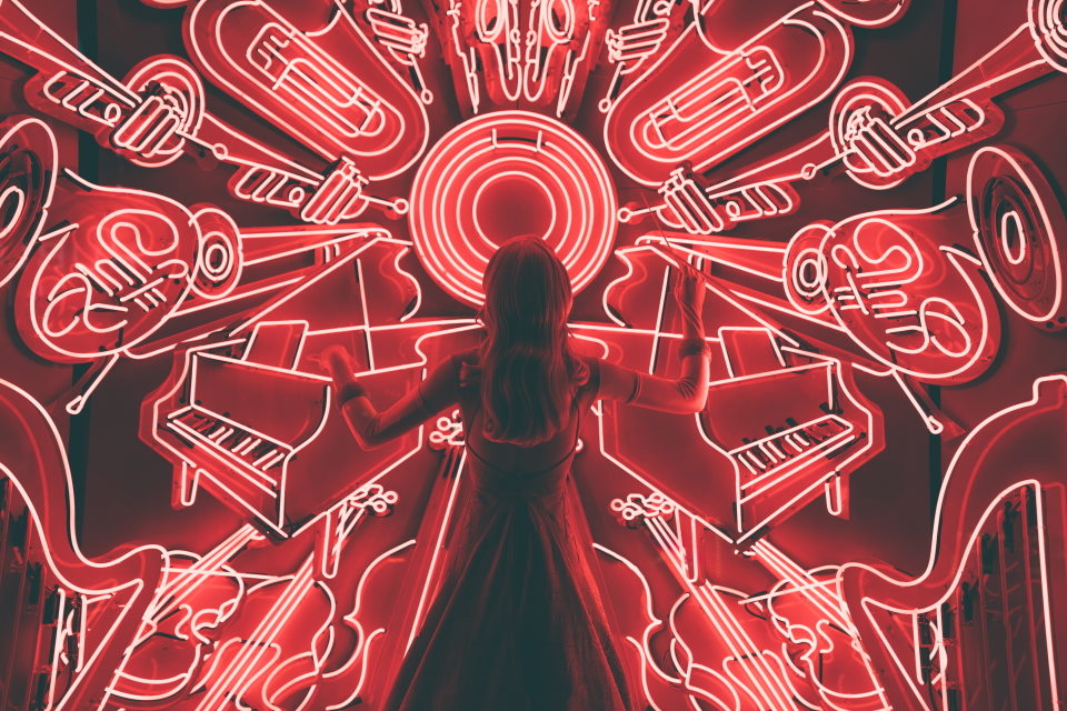Woman with neon jazz instruments