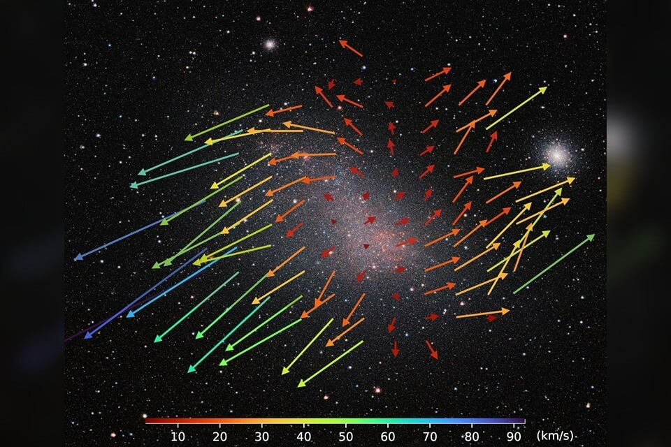 Nearby dwarf galaxy being stretched and disrupted by larger neighbour