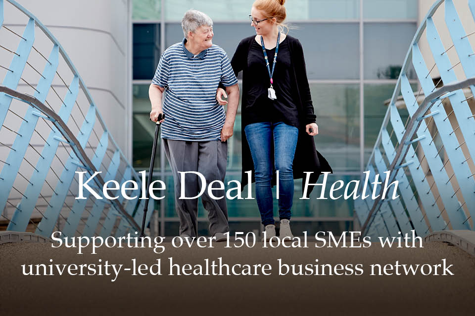 Keele Deal health- photo is a student nurse helping elderly women cross a bridge with the hospital in the background 