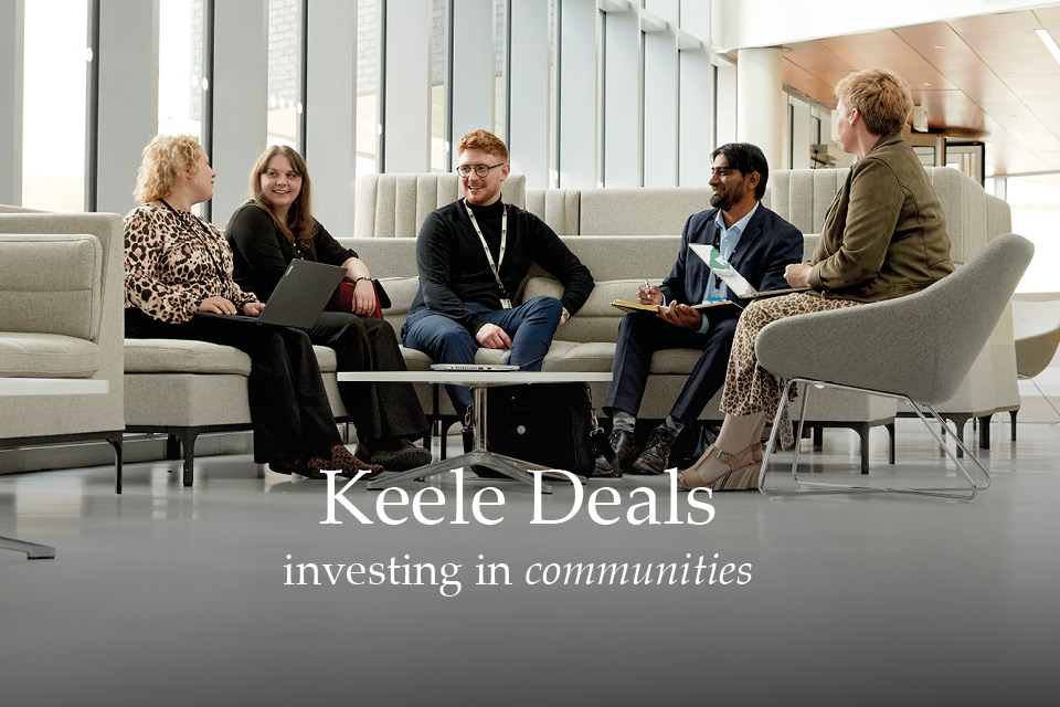 Keele Deals - photo is of five business owners male and female sitting in the atrium of the Smart Innovation Hub at Keele having a meeting 