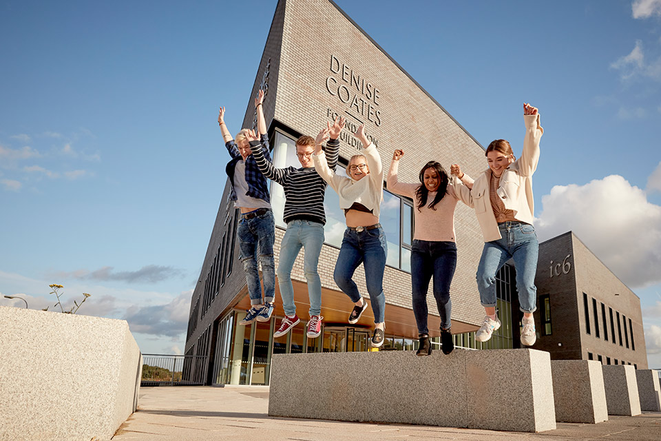 Global Challenge Pathways - students on campus at Keele university looking happy 
