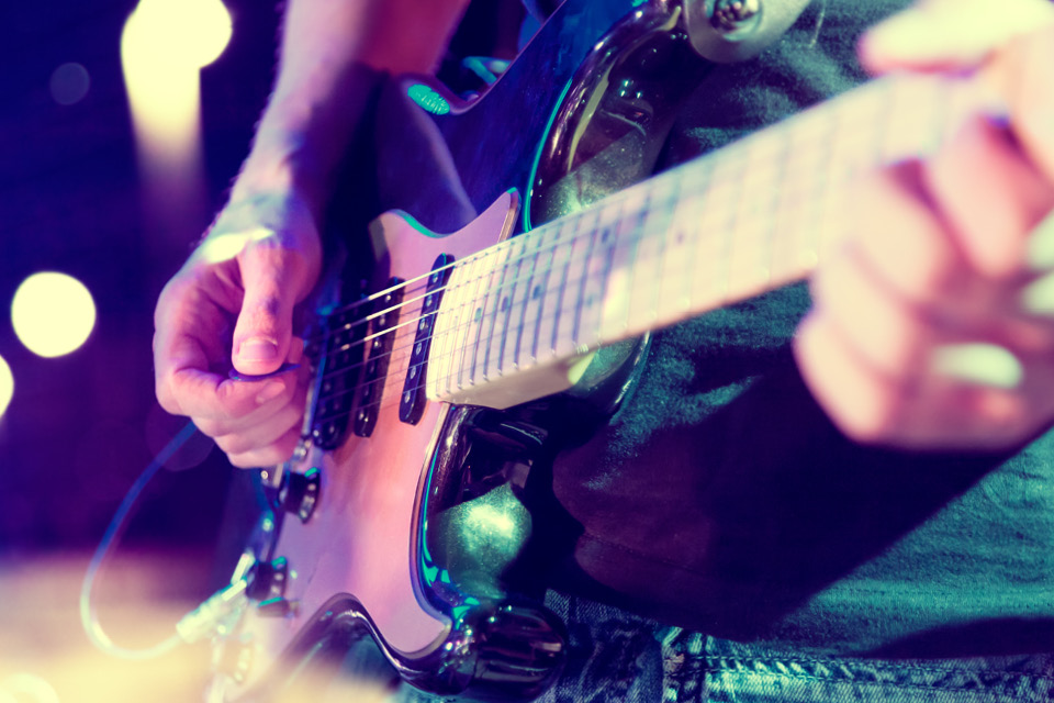 Student playing guitar