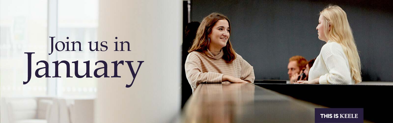 Two students talking to each other, with text overlay: 'Join us in January'