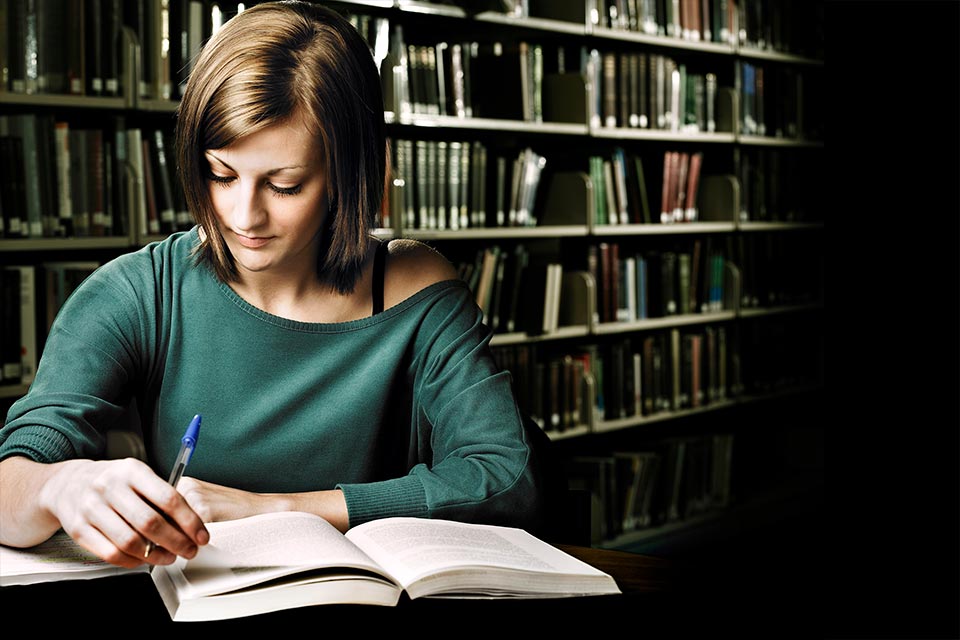 Student sitting in a library