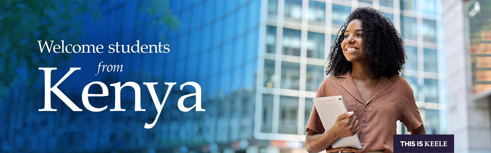 Student smiling, looking into the distance.