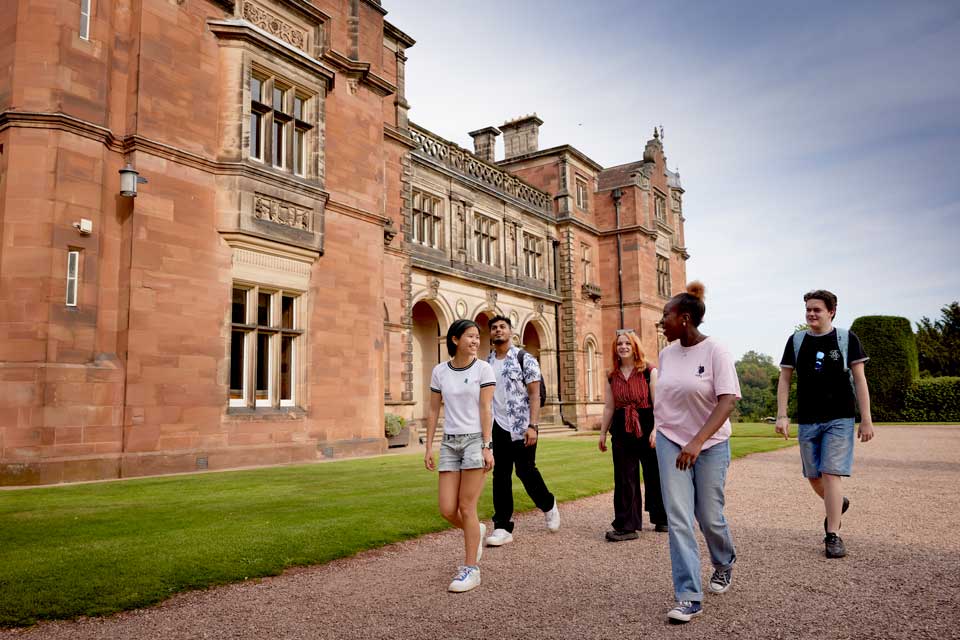 Student Life at Keele, students on campus in front of Keele Hall