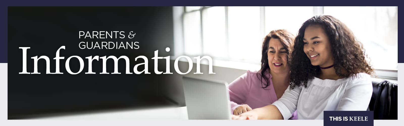 parent and child looking at laptop