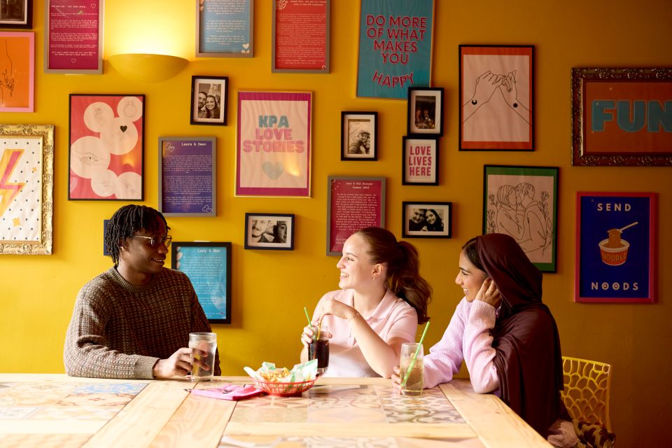 students sat at table laughing