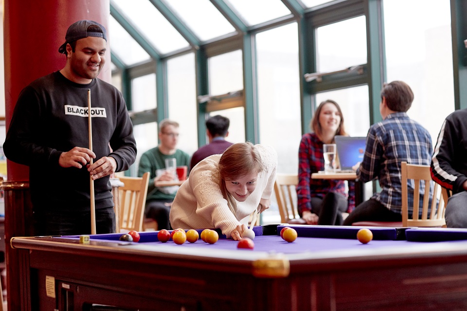 Students playing snooker