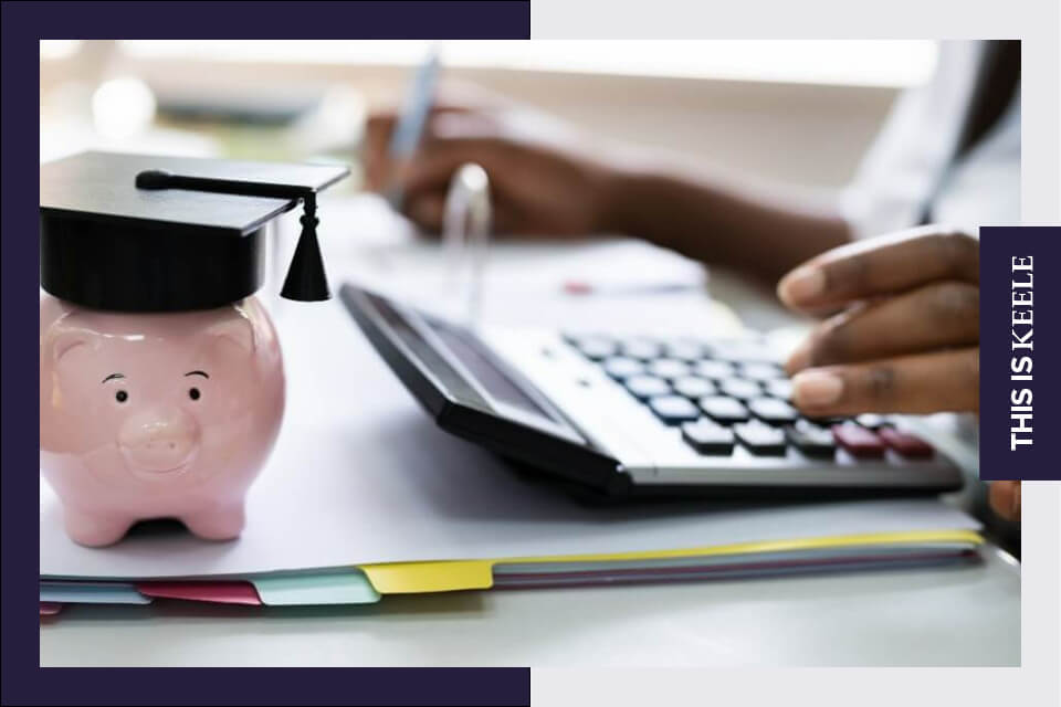 Student working on finances at desk 