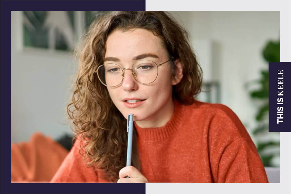 Student researching on laptop