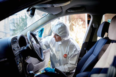 A Forensic Science student processing a car as part of our crime scene facilities.